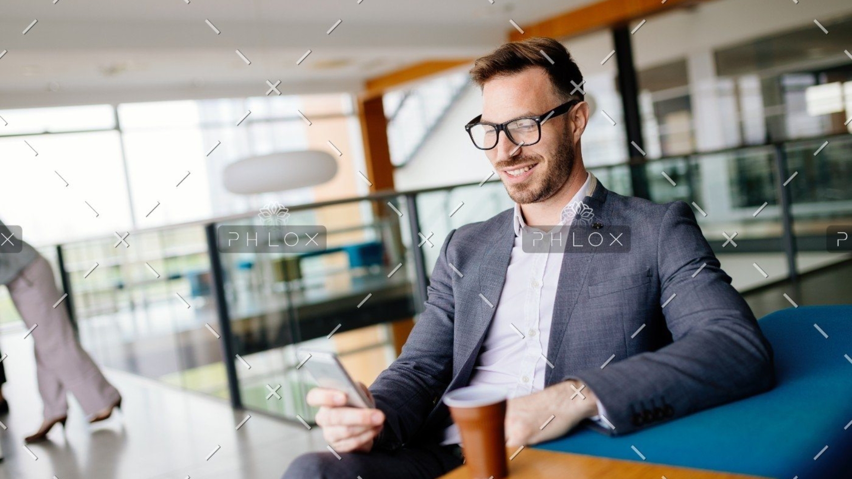 demo-attachment-2706-businessman-taking-a-break-with-a-cup-of-coffee-JW4B3DH